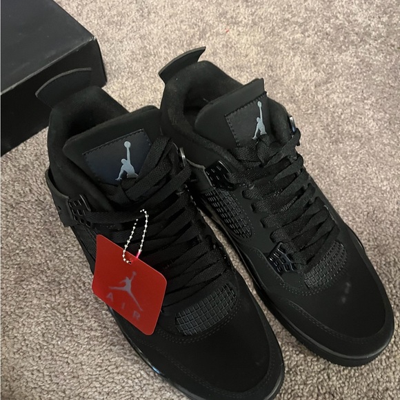 This Jordan 4 is composed of a black nubuck suede upper, black, mesh, netting - Picture 8 of 10